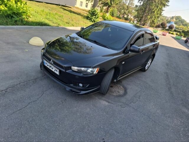 Чорний Міцубісі Lancer, об'ємом двигуна 2 л та пробігом 230 тис. км за 6650 $, фото 1 на Automoto.ua