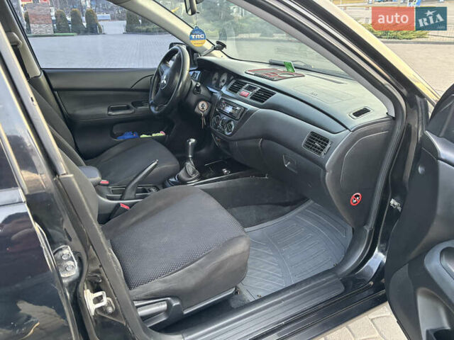 Чорний Міцубісі Lancer, об'ємом двигуна 1.58 л та пробігом 344 тис. км за 3999 $, фото 1 на Automoto.ua