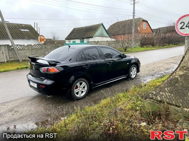 Чорний Міцубісі Lancer, об'ємом двигуна 2 л та пробігом 226 тис. км за 6600 $, фото 1 на Automoto.ua