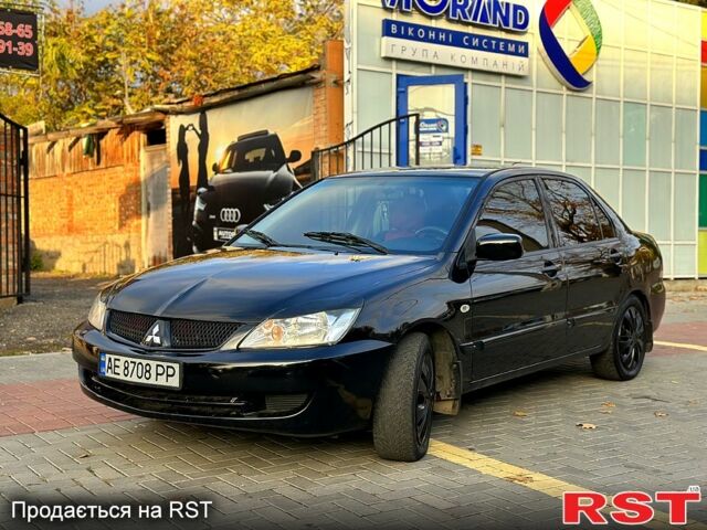 Чорний Міцубісі Lancer, об'ємом двигуна 1.6 л та пробігом 202 тис. км за 5700 $, фото 1 на Automoto.ua