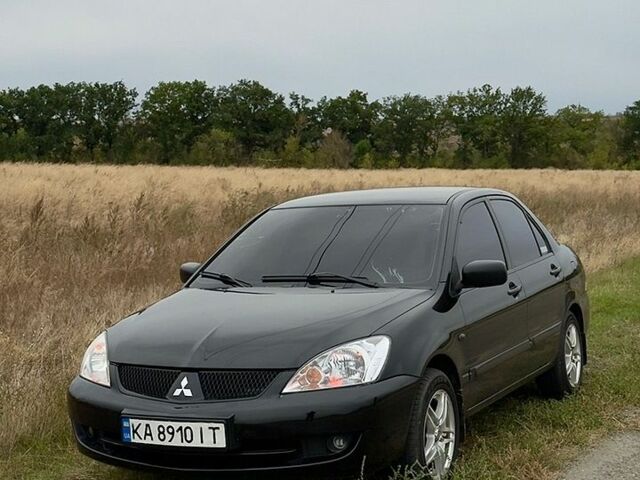 Чорний Міцубісі Lancer, об'ємом двигуна 1.58 л та пробігом 318 тис. км за 3600 $, фото 1 на Automoto.ua