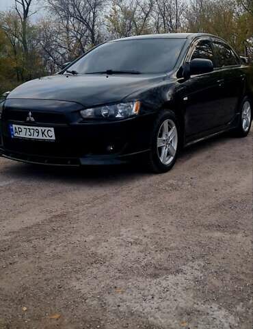Черный Мицубиси Лансер, объемом двигателя 2 л и пробегом 211 тыс. км за 6900 $, фото 1 на Automoto.ua