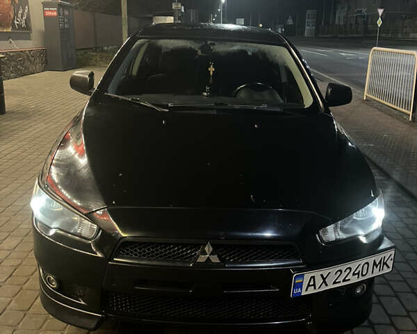 Черный Мицубиси Лансер, объемом двигателя 2 л и пробегом 270 тыс. км за 5400 $, фото 1 на Automoto.ua