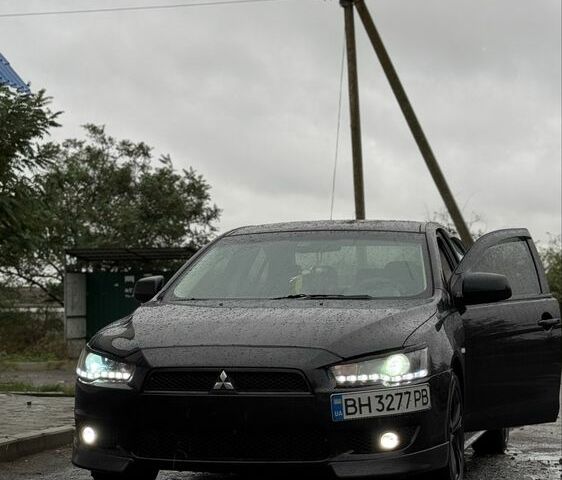 Черный Мицубиси Лансер, объемом двигателя 2 л и пробегом 140 тыс. км за 7200 $, фото 1 на Automoto.ua