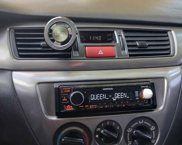 Чорний Міцубісі Lancer, об'ємом двигуна 1.58 л та пробігом 323 тис. км за 4500 $, фото 1 на Automoto.ua