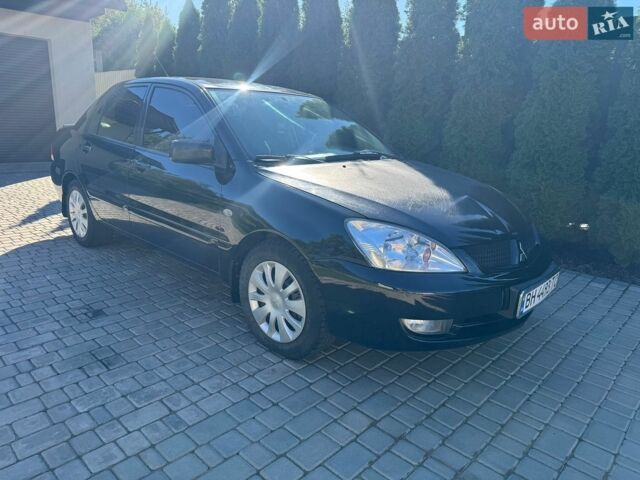 Чорний Міцубісі Lancer, об'ємом двигуна 1.58 л та пробігом 223 тис. км за 3450 $, фото 1 на Automoto.ua