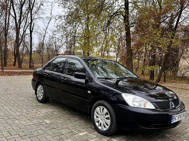 Черный Мицубиси Лансер, объемом двигателя 1.6 л и пробегом 185 тыс. км за 5500 $, фото 1 на Automoto.ua