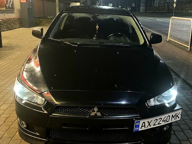 Черный Мицубиси Лансер, объемом двигателя 2 л и пробегом 20000 тыс. км за 5400 $, фото 1 на Automoto.ua