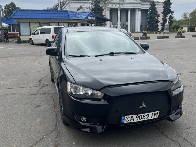Черный Мицубиси Лансер, объемом двигателя 2 л и пробегом 280 тыс. км за 5000 $, фото 1 на Automoto.ua
