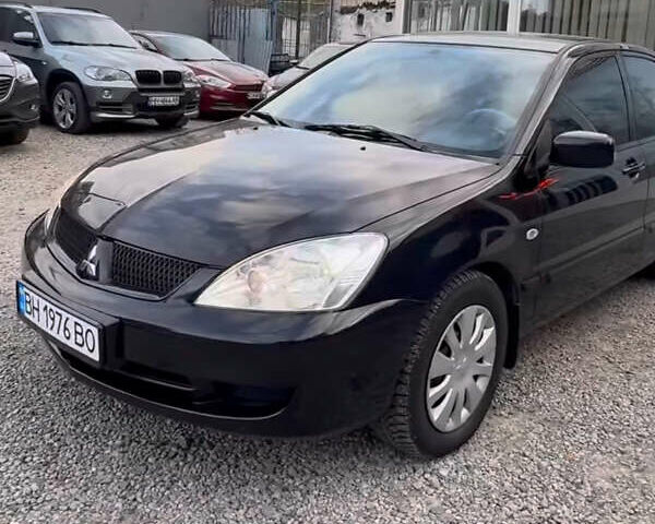 Черный Мицубиси Лансер, объемом двигателя 1.58 л и пробегом 469 тыс. км за 4600 $, фото 1 на Automoto.ua