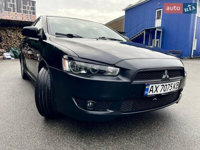 Чорний Міцубісі Lancer, об'ємом двигуна 2 л та пробігом 217 тис. км за 5600 $, фото 1 на Automoto.ua