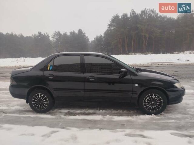 Чорний Міцубісі Lancer, об'ємом двигуна 1.6 л та пробігом 260 тис. км за 5500 $, фото 1 на Automoto.ua