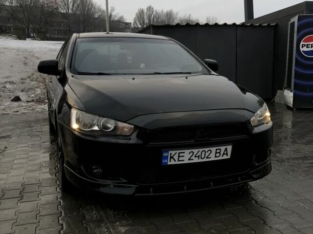 Черный Мицубиси Лансер, объемом двигателя 2 л и пробегом 116 тыс. км за 6500 $, фото 1 на Automoto.ua