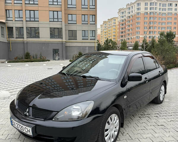 Черный Мицубиси Лансер, объемом двигателя 1.6 л и пробегом 240 тыс. км за 5200 $, фото 1 на Automoto.ua
