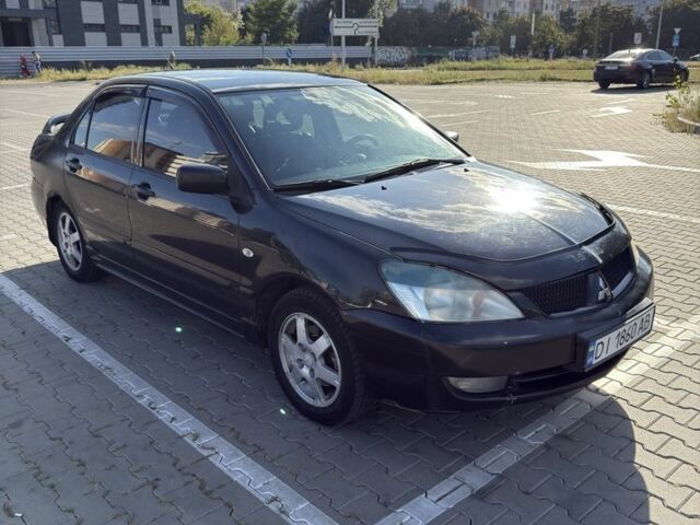 Чорний Міцубісі Lancer, об'ємом двигуна 1.6 л та пробігом 364 тис. км за 3000 $, фото 1 на Automoto.ua