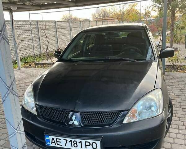 Чорний Міцубісі Lancer, об'ємом двигуна 1.6 л та пробігом 324 тис. км за 3800 $, фото 1 на Automoto.ua