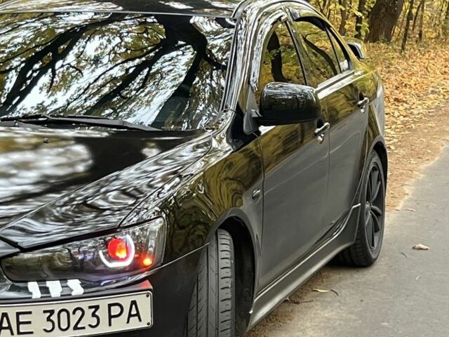 Черный Мицубиси Лансер, объемом двигателя 2 л и пробегом 230 тыс. км за 6999 $, фото 1 на Automoto.ua