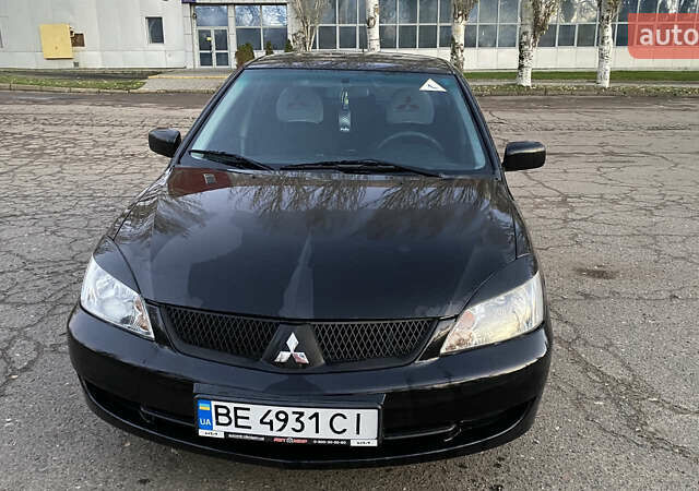 Черный Мицубиси Лансер, объемом двигателя 1.58 л и пробегом 208 тыс. км за 7000 $, фото 1 на Automoto.ua