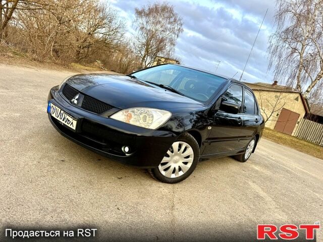 Черный Мицубиси Лансер, объемом двигателя 1.6 л и пробегом 296 тыс. км за 4990 $, фото 1 на Automoto.ua