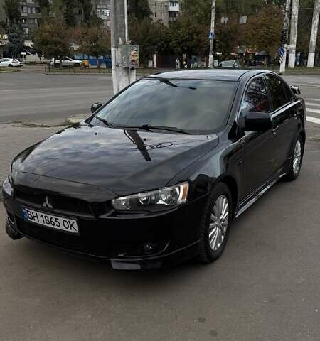 Черный Мицубиси Лансер, объемом двигателя 2 л и пробегом 222 тыс. км за 6000 $, фото 1 на Automoto.ua