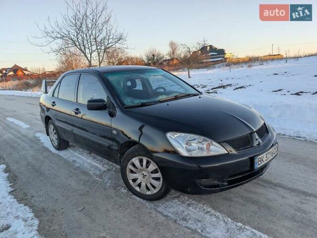Черный Мицубиси Лансер, объемом двигателя 1.6 л и пробегом 330 тыс. км за 3350 $, фото 1 на Automoto.ua