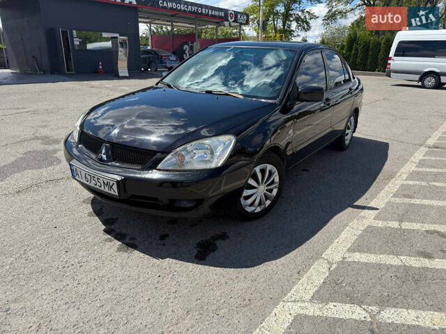 Чорний Міцубісі Lancer, об'ємом двигуна 1.6 л та пробігом 292 тис. км за 3600 $, фото 1 на Automoto.ua