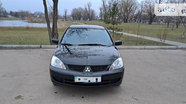 Чорний Міцубісі Lancer, об'ємом двигуна 1.6 л та пробігом 131 тис. км за 6000 $, фото 1 на Automoto.ua