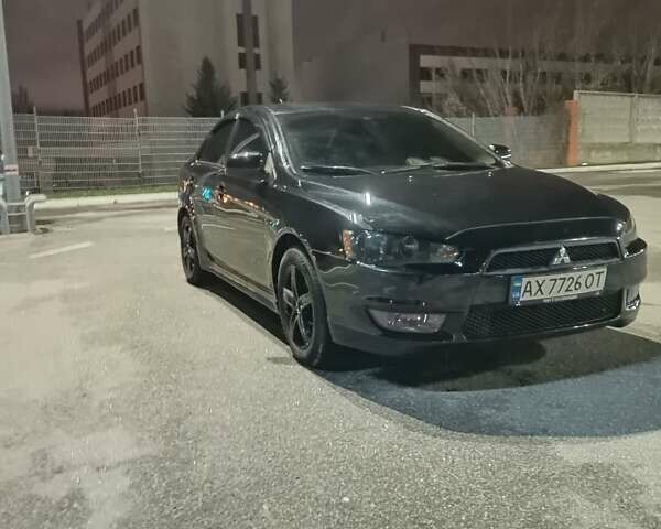 Черный Мицубиси Лансер, объемом двигателя 2 л и пробегом 240 тыс. км за 6400 $, фото 1 на Automoto.ua