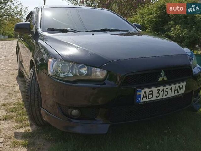 Черный Мицубиси Лансер, объемом двигателя 2 л и пробегом 214 тыс. км за 6300 $, фото 1 на Automoto.ua