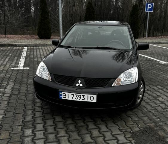 Черный Мицубиси Лансер, объемом двигателя 1.6 л и пробегом 168 тыс. км за 3700 $, фото 1 на Automoto.ua