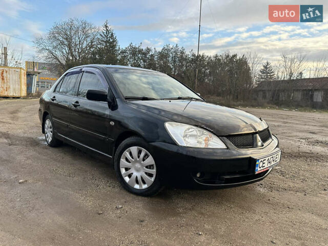 Черный Мицубиси Лансер, объемом двигателя 1.58 л и пробегом 312 тыс. км за 4900 $, фото 1 на Automoto.ua