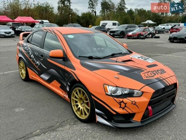 Черный Мицубиси Лансер, объемом двигателя 2 л и пробегом 1 тыс. км за 52000 $, фото 1 на Automoto.ua