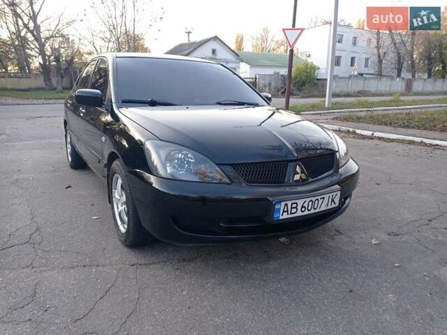 Чорний Міцубісі Lancer, об'ємом двигуна 1.58 л та пробігом 286 тис. км за 4950 $, фото 1 на Automoto.ua