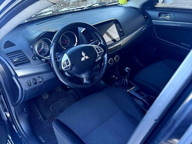 Черный Мицубиси Лансер, объемом двигателя 2 л и пробегом 31000 тыс. км за 7000 $, фото 1 на Automoto.ua