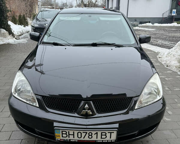 Черный Мицубиси Лансер, объемом двигателя 1.6 л и пробегом 88 тыс. км за 5950 $, фото 1 на Automoto.ua