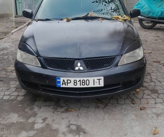 Чорний Міцубісі Lancer, об'ємом двигуна 1 л та пробігом 420 тис. км за 2352 $, фото 1 на Automoto.ua