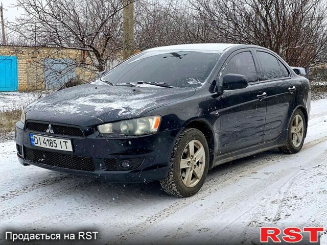 Черный Мицубиси Лансер, объемом двигателя 2 л и пробегом 246 тыс. км за 6200 $, фото 1 на Automoto.ua