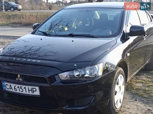 Черный Мицубиси Лансер, объемом двигателя 1.5 л и пробегом 190 тыс. км за 5899 $, фото 1 на Automoto.ua
