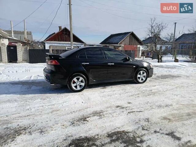 Черный Мицубиси Лансер, объемом двигателя 2 л и пробегом 240 тыс. км за 5900 $, фото 1 на Automoto.ua