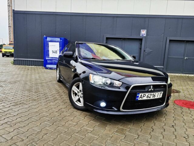 Черный Мицубиси Лансер, объемом двигателя 2 л и пробегом 240 тыс. км за 7450 $, фото 1 на Automoto.ua