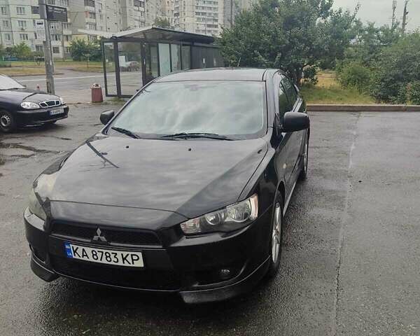 Черный Мицубиси Лансер, объемом двигателя 2 л и пробегом 229 тыс. км за 7300 $, фото 1 на Automoto.ua