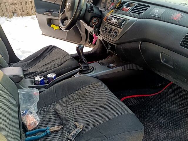 Чорний Міцубісі Lancer, об'ємом двигуна 1.6 л та пробігом 26000 тис. км за 1800 $, фото 1 на Automoto.ua