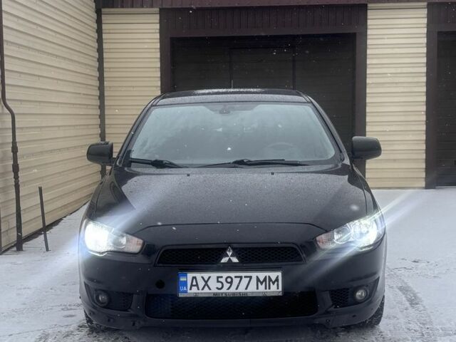 Черный Мицубиси Лансер, объемом двигателя 2 л и пробегом 225 тыс. км за 7000 $, фото 1 на Automoto.ua