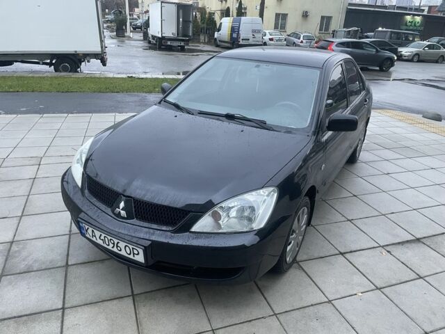 Черный Мицубиси Лансер, объемом двигателя 1.6 л и пробегом 226 тыс. км за 3750 $, фото 1 на Automoto.ua