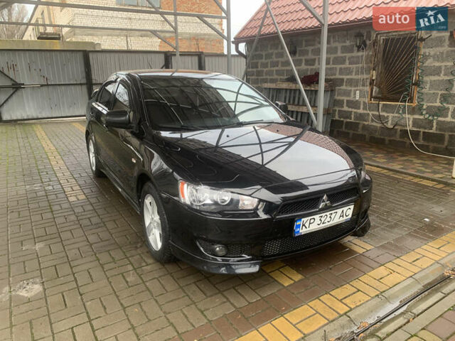 Черный Мицубиси Лансер, объемом двигателя 2 л и пробегом 64 тыс. км за 10200 $, фото 1 на Automoto.ua