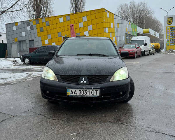 Черный Мицубиси Лансер, объемом двигателя 1.58 л и пробегом 333 тыс. км за 3900 $, фото 1 на Automoto.ua