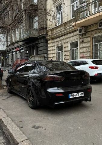 Черный Мицубиси Лансер, объемом двигателя 2 л и пробегом 200 тыс. км за 7500 $, фото 1 на Automoto.ua