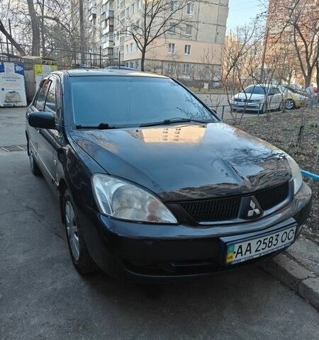 Черный Мицубиси Лансер, объемом двигателя 1.6 л и пробегом 192 тыс. км за 5000 $, фото 1 на Automoto.ua