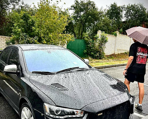 Чорний Міцубісі Lancer, об'ємом двигуна 2 л та пробігом 223 тис. км за 7800 $, фото 1 на Automoto.ua