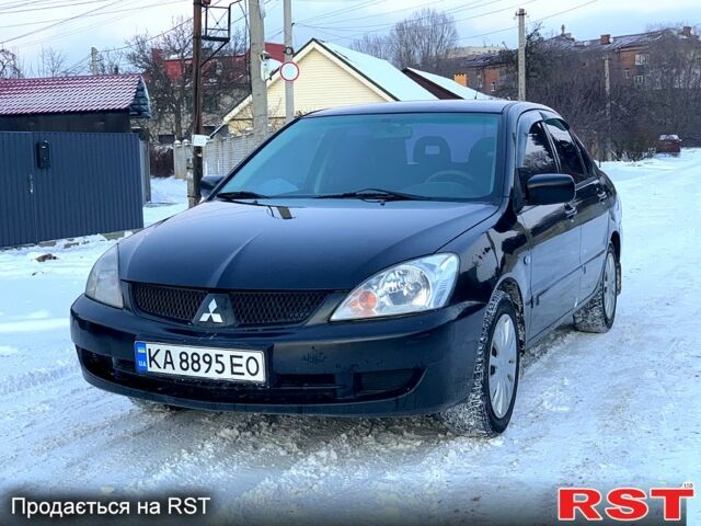 Черный Мицубиси Лансер, объемом двигателя 1.6 л и пробегом 22000 тыс. км за 3950 $, фото 1 на Automoto.ua